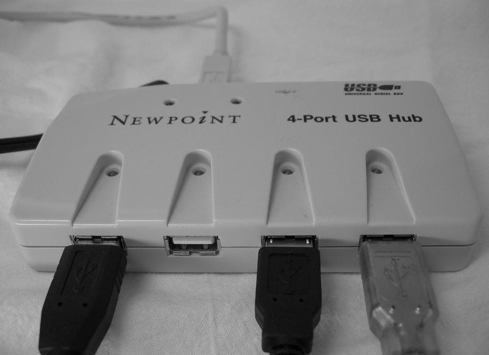 A powered USB hub not only turns one USB port into four USB ports, but supplies extra juice to USB devices that draw a lot of current—usually devices with bright lights, motors, hard drives, or other power-sapping features.