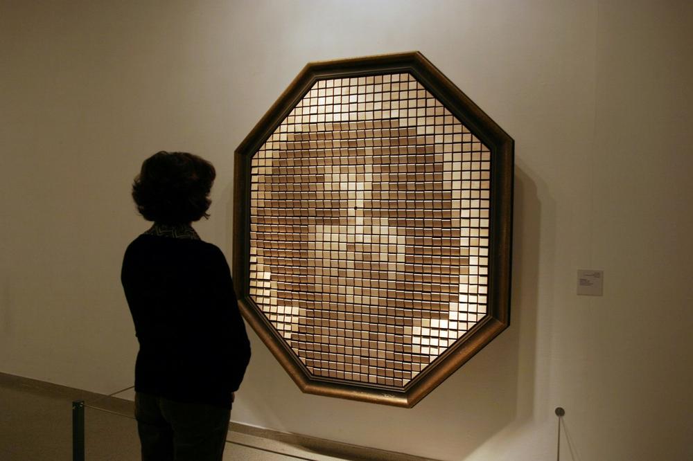 The Wooden Mirror, which comprises a camera and dozens of individual slats of wood on motors, "reflects" the image of the person standing in front of it. Courtesy Danny Rozen.