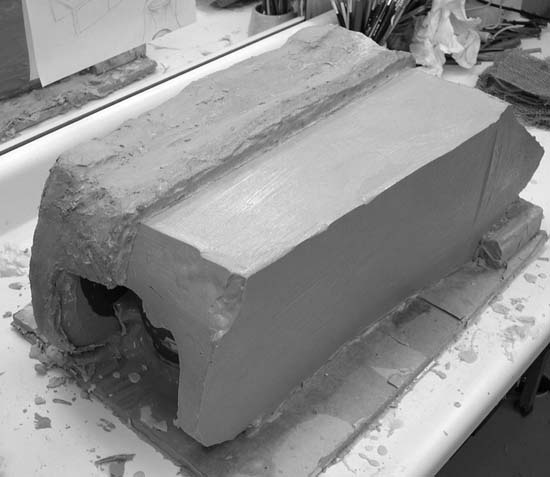The silicone mold with one half of its plaster support shell