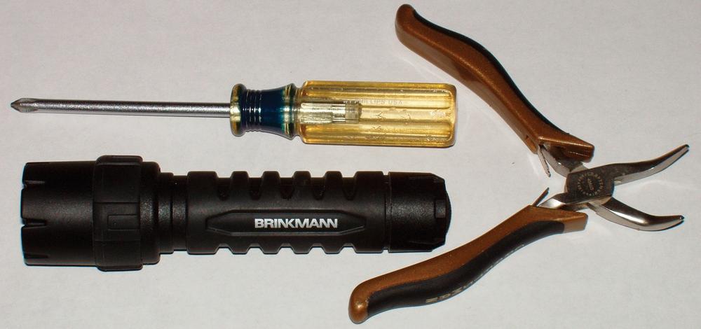A basic toolkit: #1 Phillips screwdriver, flashlight, and needlenose pliers