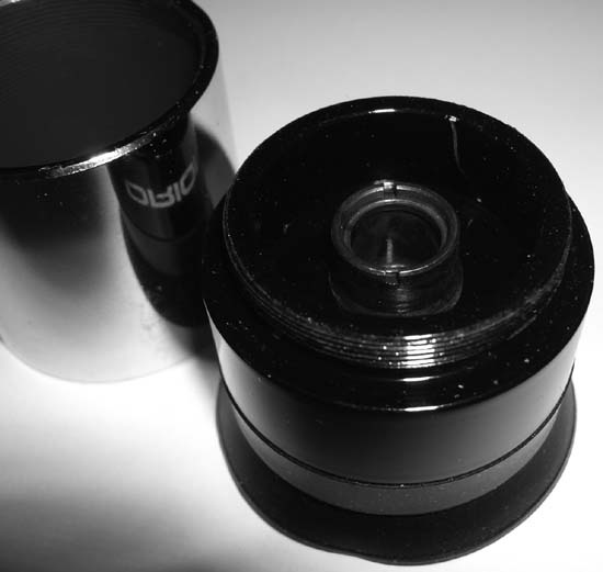 Remove the barrel from the PlÃ¶ssl eyepiece to reveal the field lens and field stop