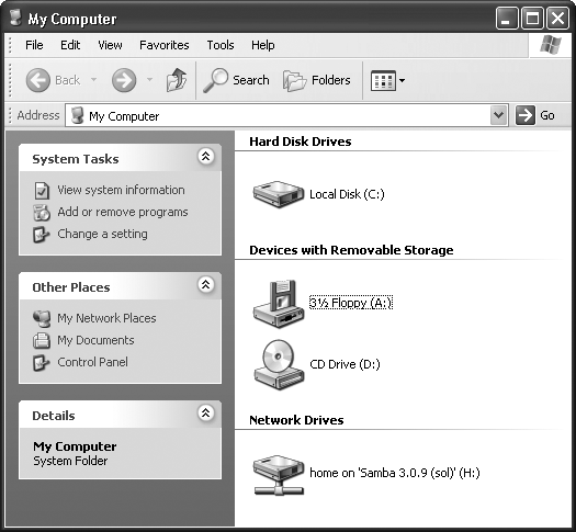 The My Computer window, shown here on a corporate-network PC, is the starting point for any folder-digging you want to do. It shows the disk drives of your PC. If you double-click the icon of a removable-disk drive (like your CD-ROM drive, Zip drive, or Jaz drive), you receive only an error message unless there’s actually a disk in the drive.