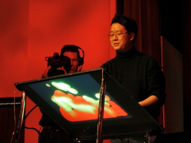 Jeff Han demos a multitouch touchscreen at the 2006 TED conference. Since then, Han has created Perceptive Pixel, a company that produces these devices for high-end clients. Courtesy TED Conferences, LLC.