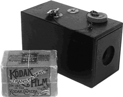 The original Kodak camera and a roll of Kodak film.