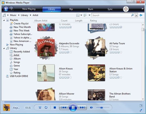 Windows Media Player 11 displays music by genre or by artist (shown here) in stacks that show the number of tracks and total playing time.