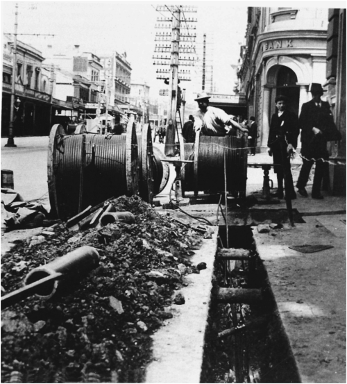 Picture taken in the year 1908 in New Zealand. Laying down of cables for the Auckland City Council's power distribution system is in progress.