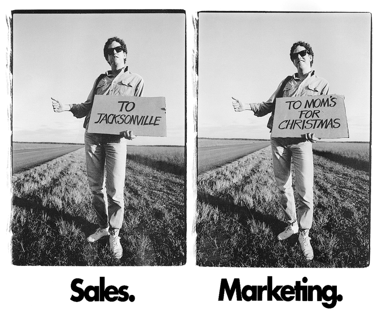 Figure depicting two photographs of the same person standing on the roadside asking for lift. The photograph on left represents sales, where the person is holding a board that reads “To Jacksonville.” The photograph on the right represents marketing, where the person is holding a board that reads “To mom's for Christmas.”