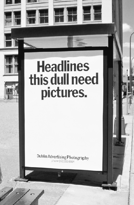 Figure depicting an advertisement board of Dublin advertising photography that reads, “Headlines this dull need pictures.”