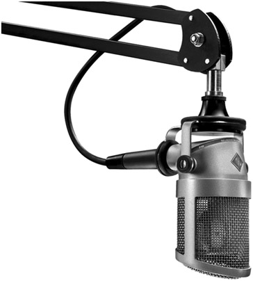 Figure 4.1 The studio microphone changes the announcer’s voice into an electrical signal. (Image courtesy of Neumann/USA.)