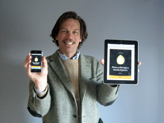 The author with iPhone and iPad Apps for Absolute Beginners displayed on both devices.