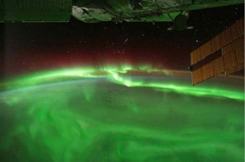 Aurora caused by solar activity charging the Earth’s ionosphere, as viewed from space.  Image courtesy of NASA.