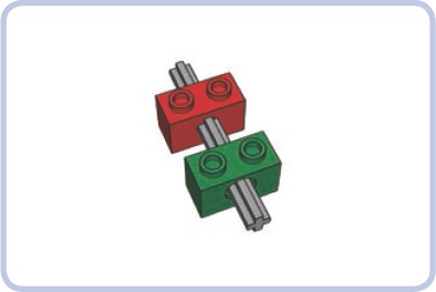 A regular axle put through two Technic bricks: The red brick has an X-shaped axle hole that locks the axles, while the green brick has a pin hole that allows the axle to rotate freely.