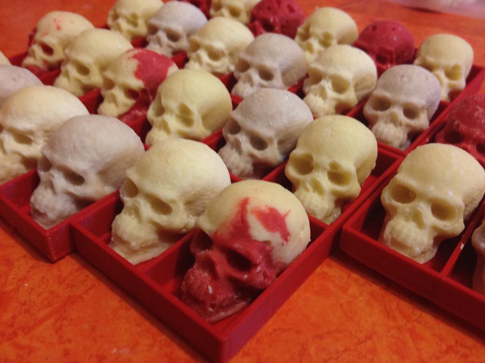 The white chocolate skulls, with red chocolate oil